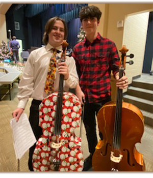 Two male students with cellos