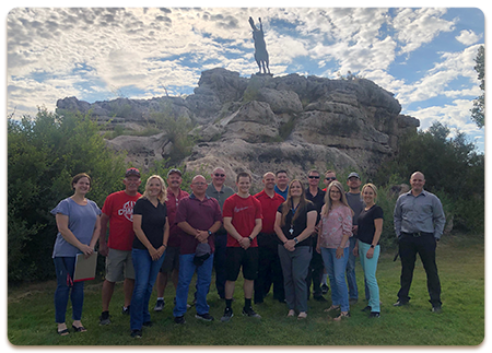 Mogollon Junior High and High School staff members pose outside together